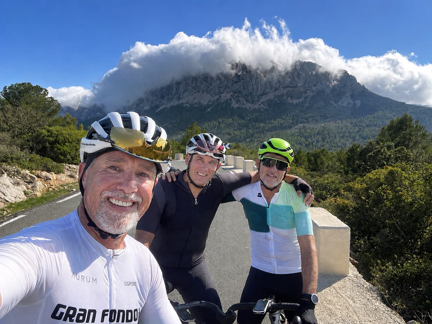Three riders below the Bernia ridge